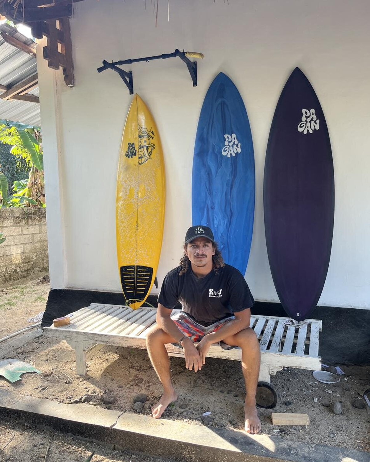 Franco outside the workshop with three finished boards