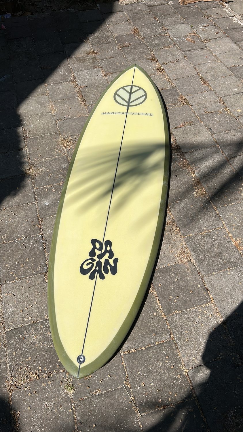 Pale yellow board on volcanic paving